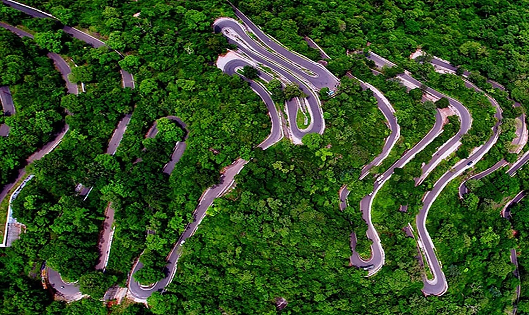 The ghat road stacked up the hillside, bend after bend